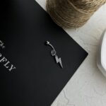 پیرسینگ ناف استیل زنانه مدل رعد و برق جواهری کد P4822