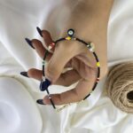 پابند زنانه تابستانی مهره ای مدل سکه چشم نظر کد A4650