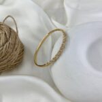 دستبند زنانه ژوپینگ بنگل مدل پیچ جواهری B5605